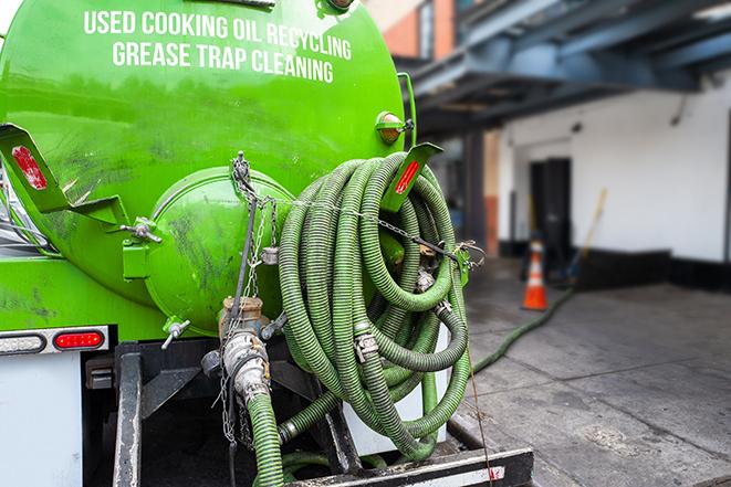 a service truck pumping grease from a restaurant's grease trap in Allentown